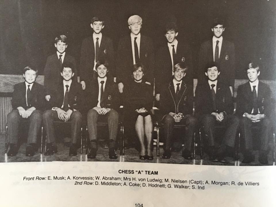 black and white photo of some kids in suits