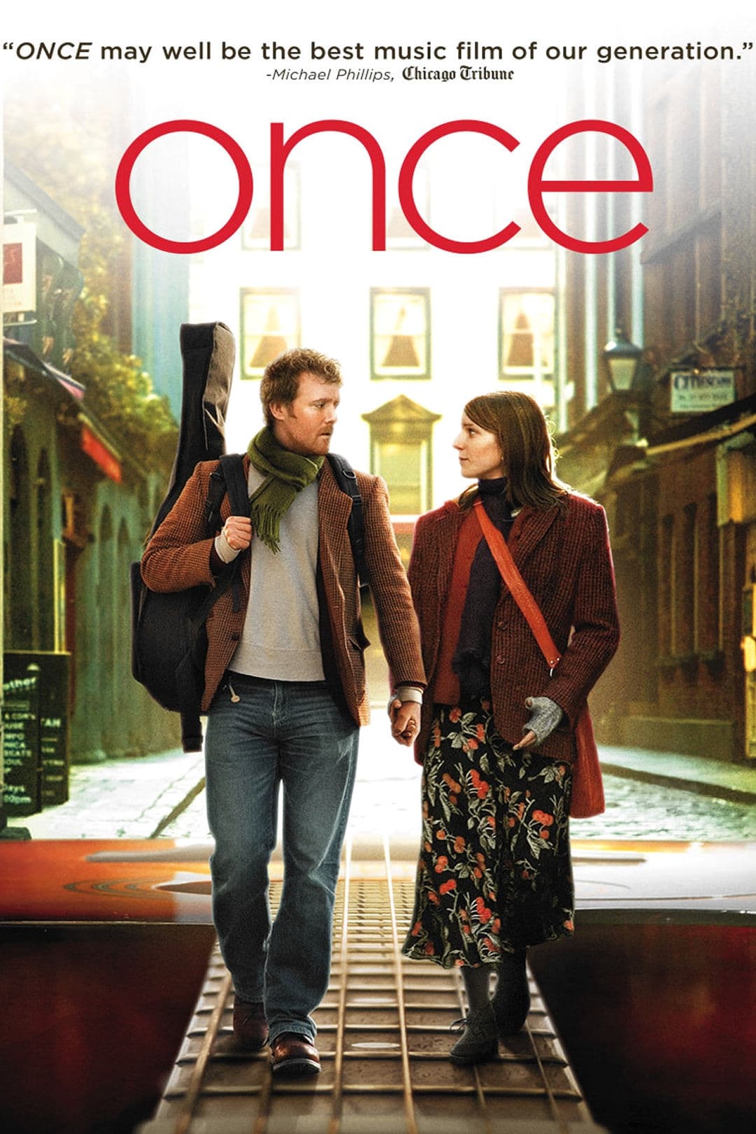 Once movie poster: a man and a woman holding hands while along a walk down a street which has been edited to be along the fretboard of a guitar